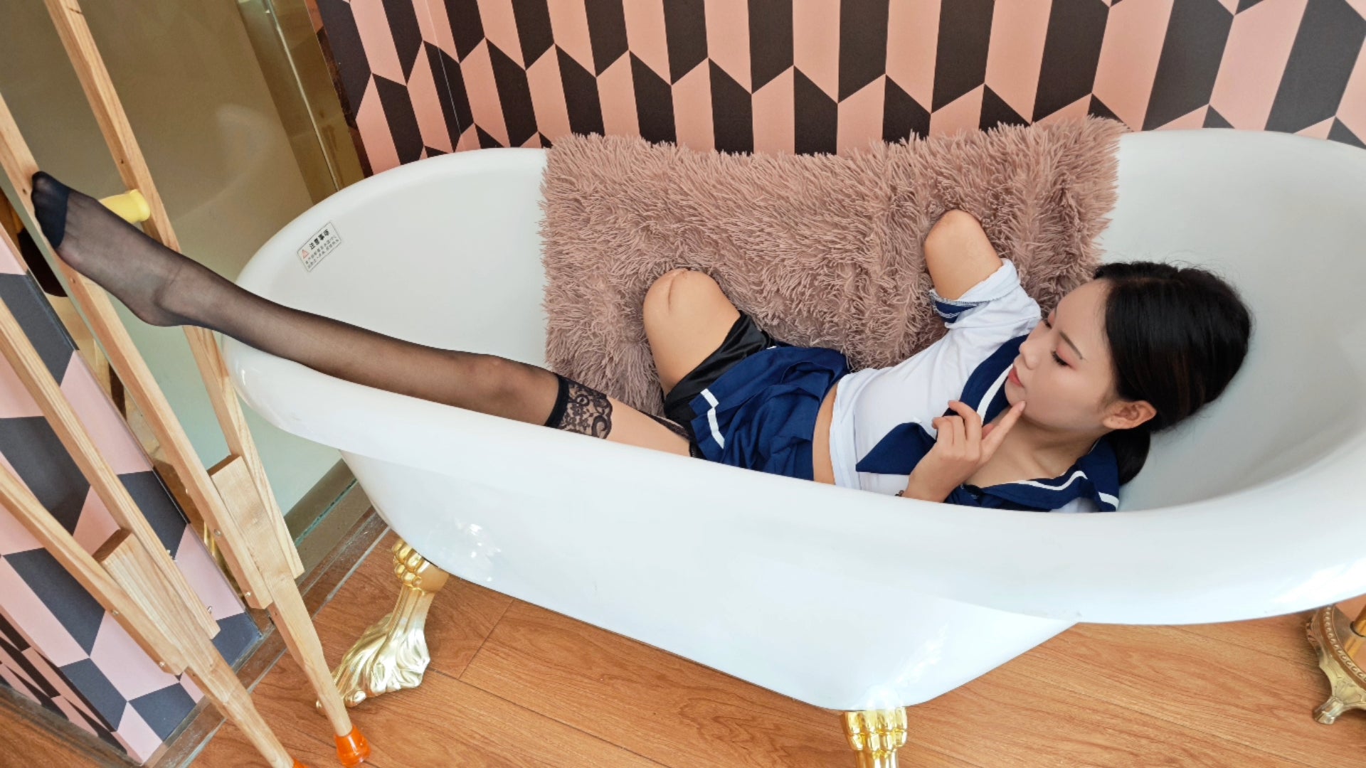 Abby: Ooe Amputee Girl, feeling her prosthetic limb while wearing a Japanese school uniform.