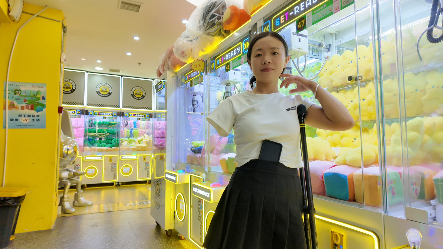 Mila: Ooe, the amputee girl, walking alone by the river with crutches.