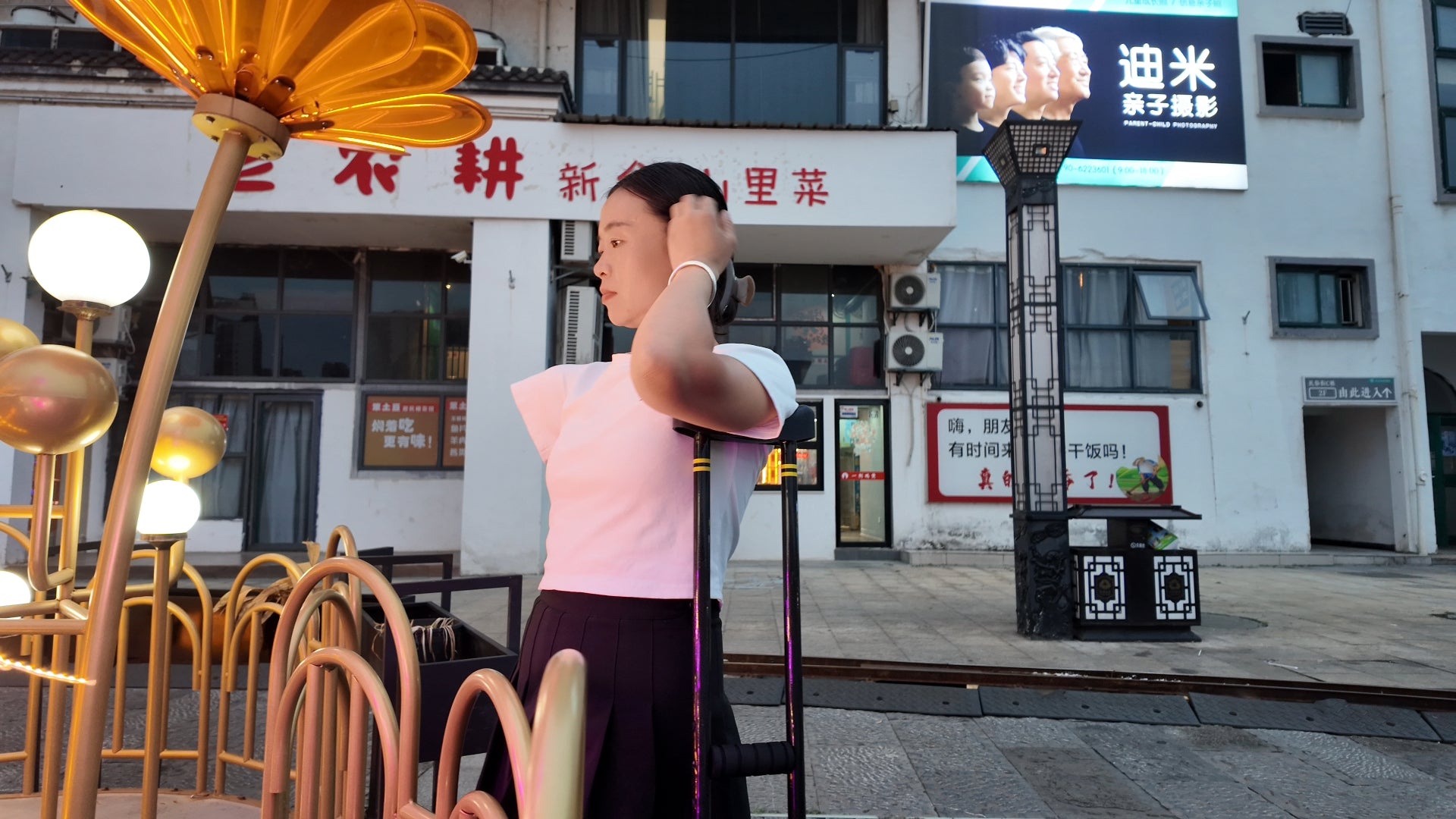 Mila: Ooe, the amputee girl, walking alone by the river with crutches.