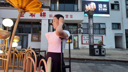 Mila: Ooe, the amputee girl, walking alone by the river with crutches.