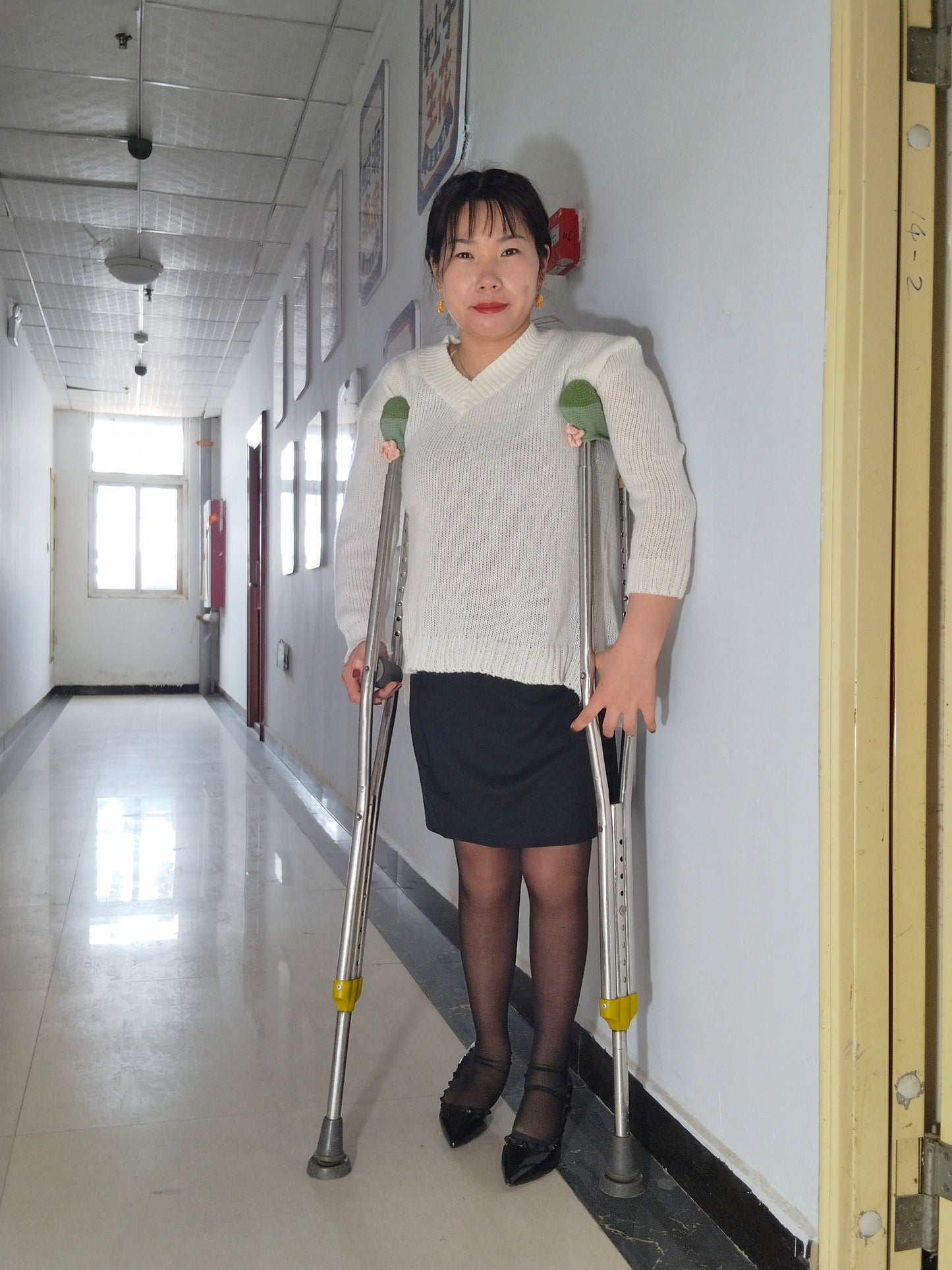 Twlia, a girl with polio - high heels and stockings going up and down stairs