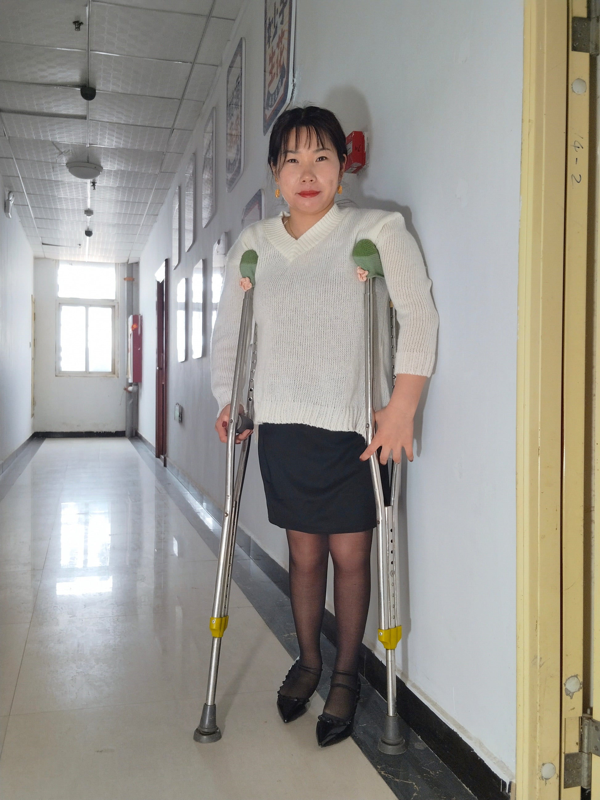 Twlia, a girl with polio - high heels and stockings going up and down stairs