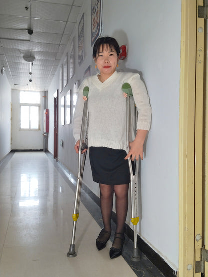 Twlia, a girl with polio - high heels and stockings going up and down stairs
