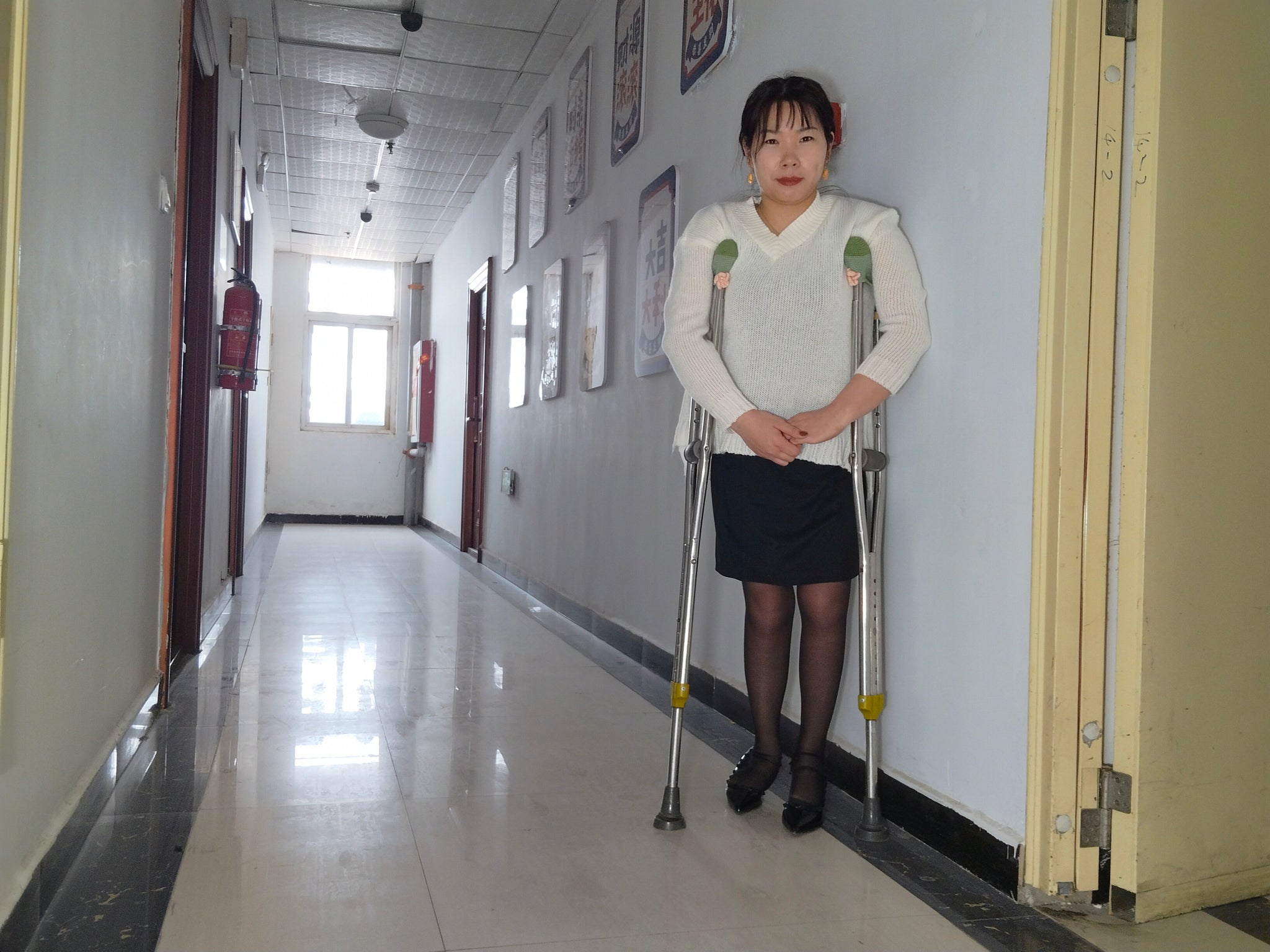 Twlia, a girl with polio - high heels and stockings going up and down stairs