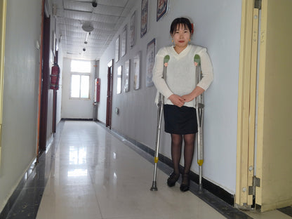 Twlia, a girl with polio - high heels and stockings going up and down stairs