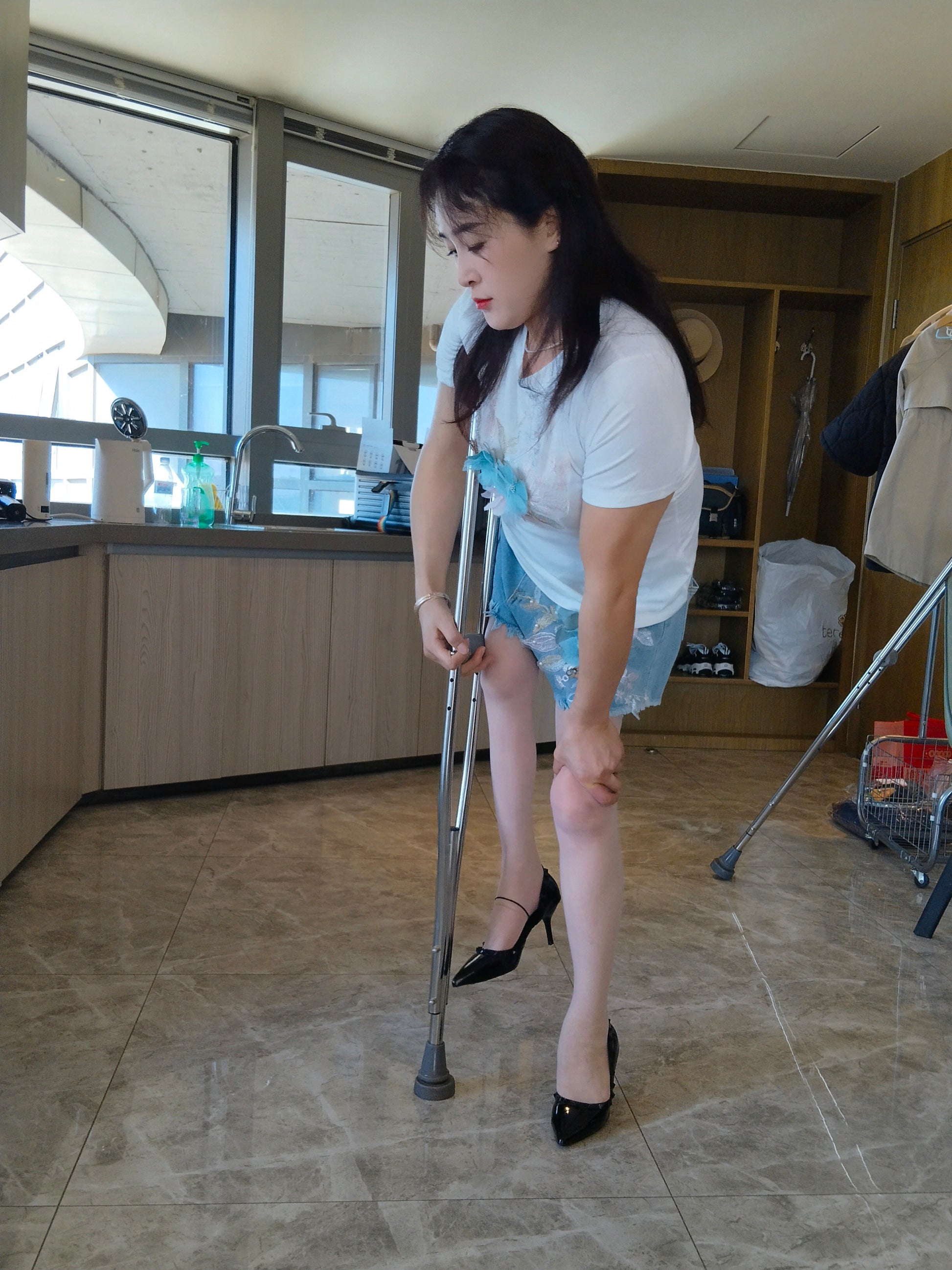 Rose the Polio Girl - Wearing high heels and using crutches to pick up takeout