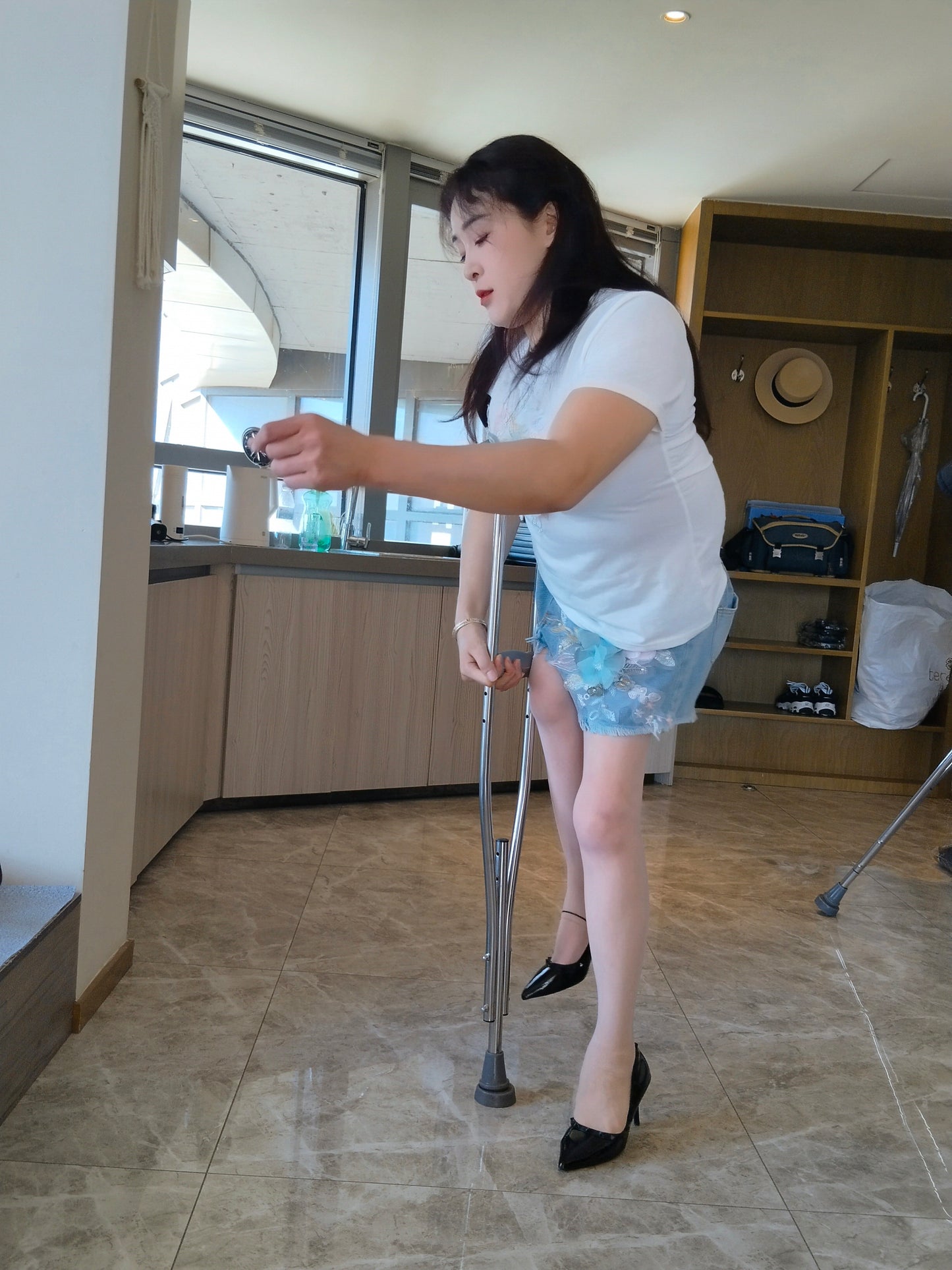 Rose the Polio Girl - Wearing high heels and using crutches to pick up takeout
