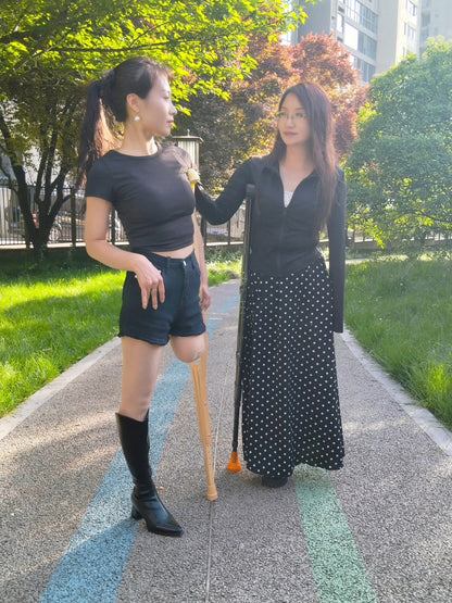 Ayla: Sak Amputee Girl – Happy times playing soccer with Lanzi while on crutches