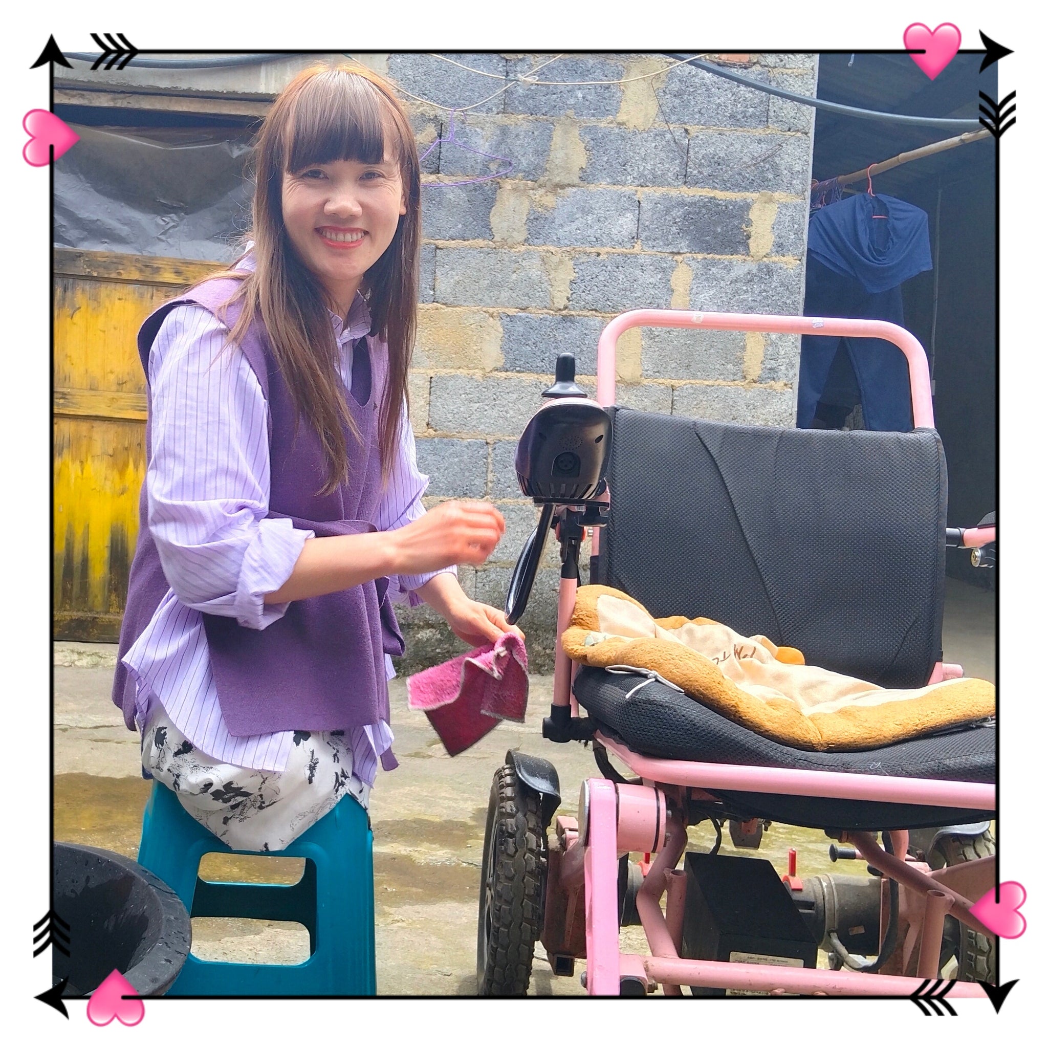 The DAK Girl, Lvy — Sitting on a Bench, Cleaning a Wheelchair