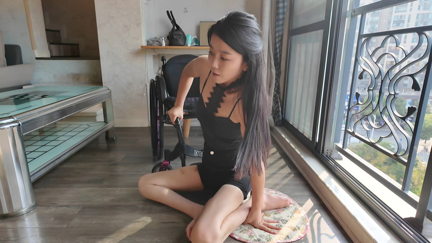 Belle: A paraplegic girl - crawling on the sofa