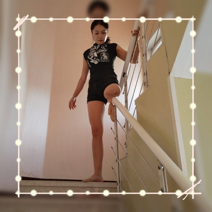Naomi Sak, an amputee girl - climbing stairs on one leg while wearing stockings