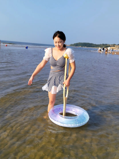 Naomi Sak, an amputee girl - swimming in the sea at the beach