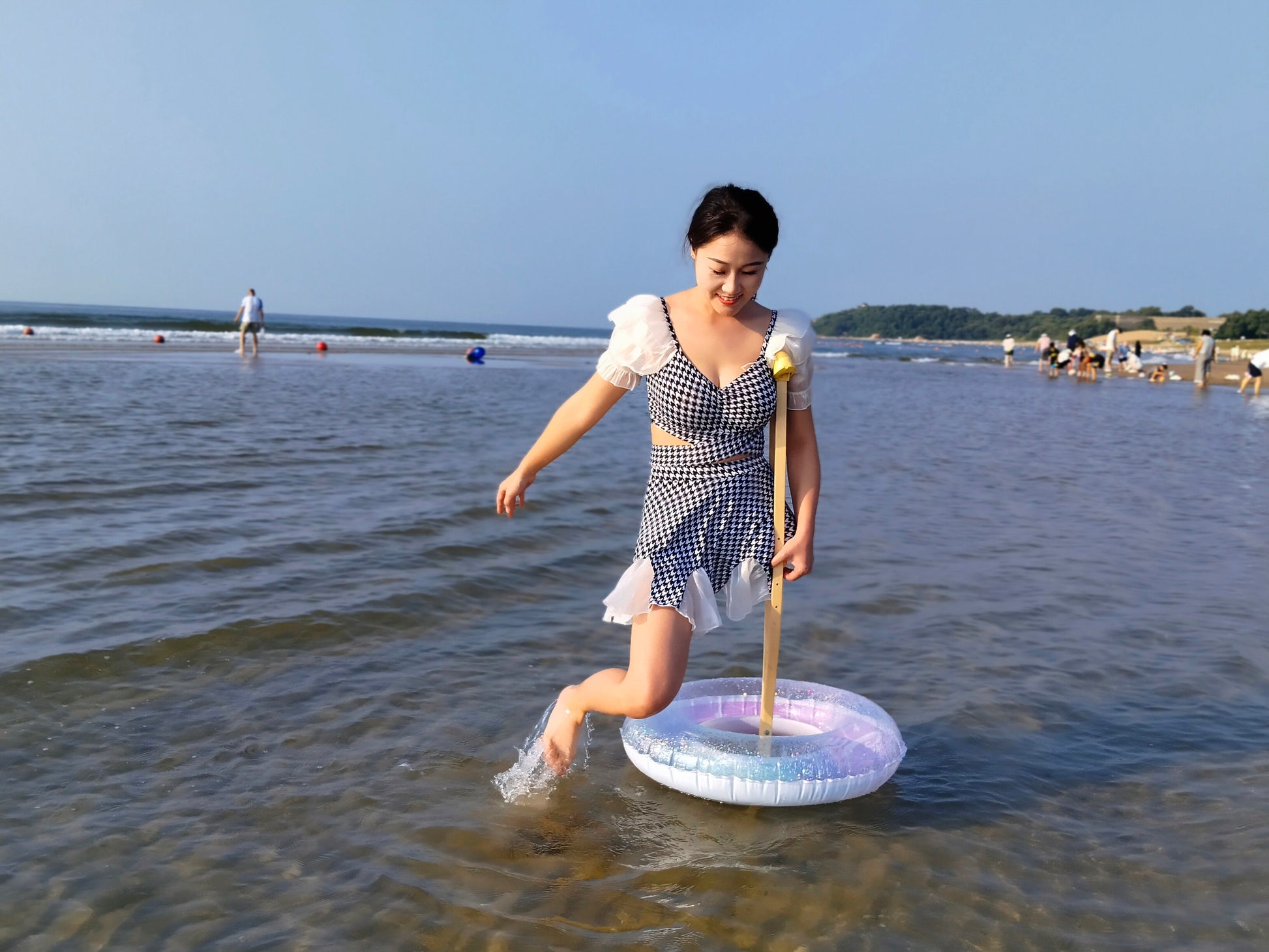 Naomi Sak, an amputee girl - swimming in the sea at the beach