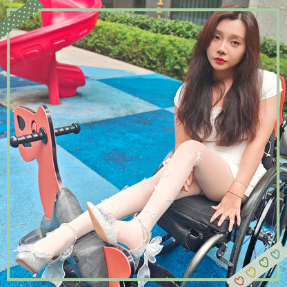 The Para Girl Kitty – Sliding down a slide in white stockings and high heels.