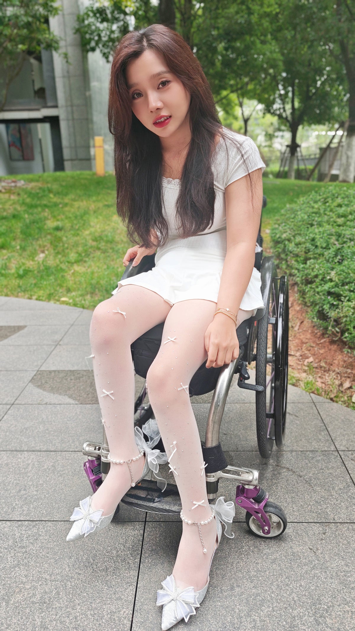 The Para Girl Kitty – Sliding down a slide in white stockings and high heels.
