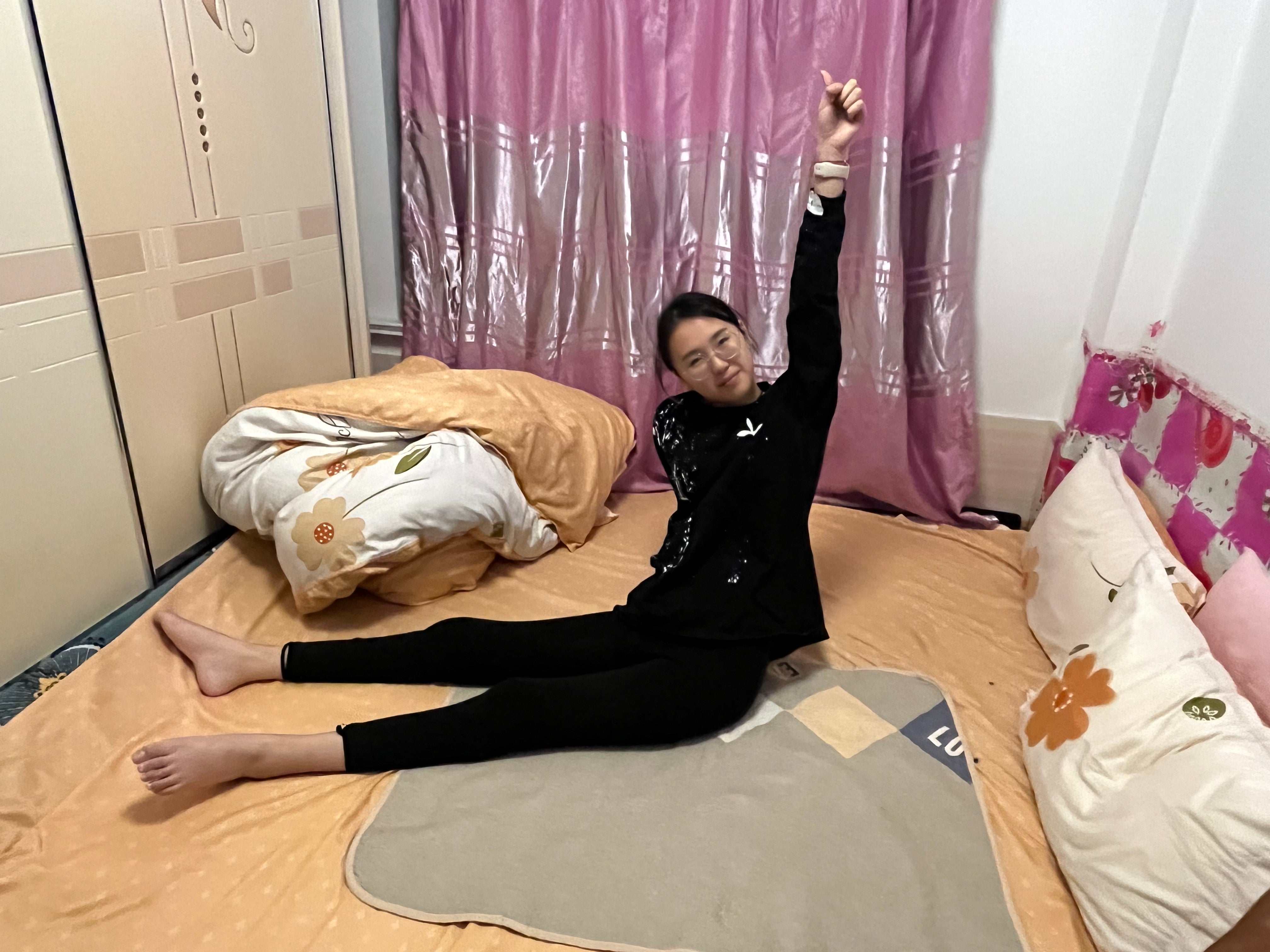 Zoe: Paraplegic Girl - Using her feet to play on her phone during rehabilitation training