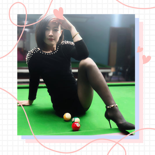 Emma: Amputee lady practicing billiards