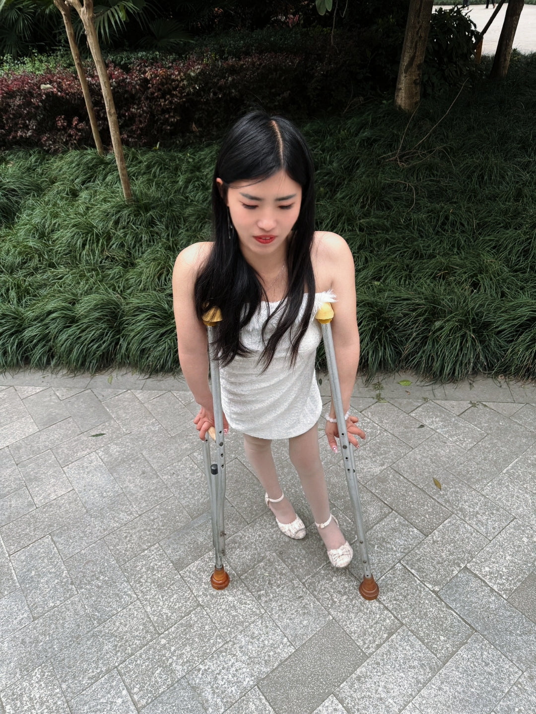 Maria: Polio Girl - Walking with crutches in a white chiffon dress