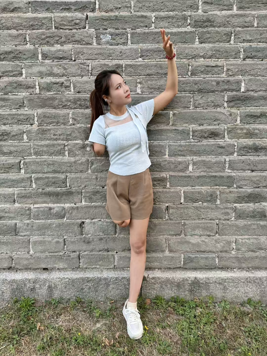 Abby: Ooe Amputee Girl - hopping under the city walls - AmputeeClub