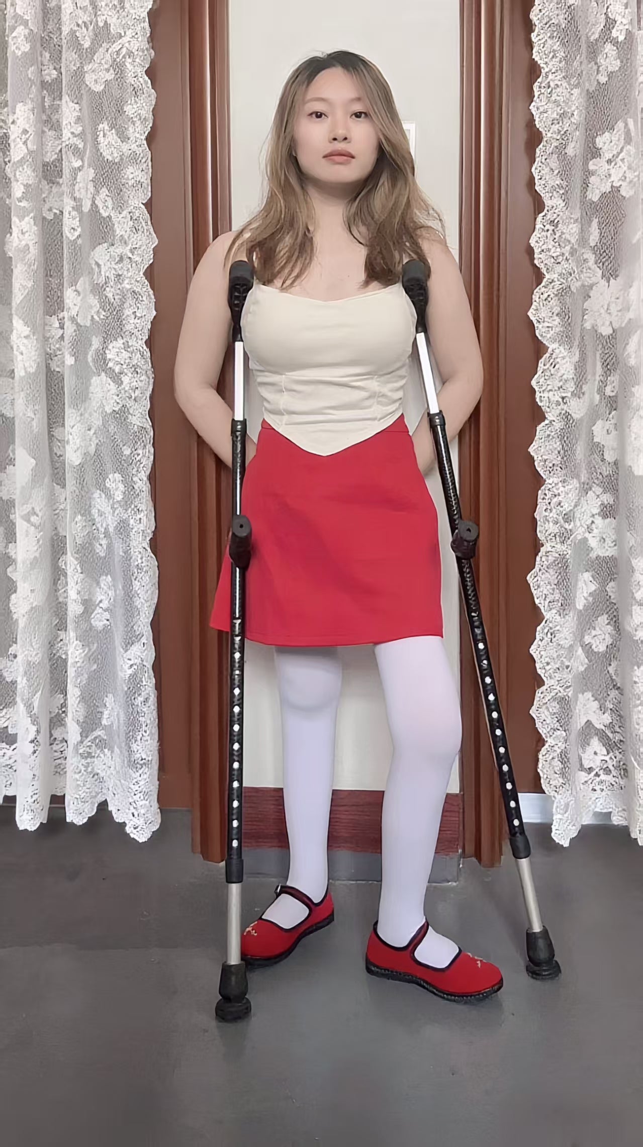 Miki: Polio Girl - Red Shoes and White Socks - AmputeeClub