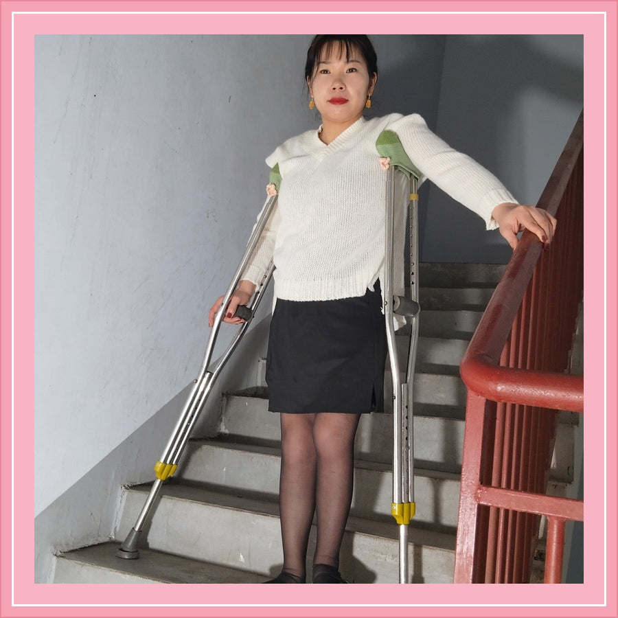 Twlia, a girl with polio - high heels and stockings going up and down stairs